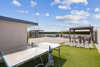 Tropical pool deck with large sundeck and cabanas